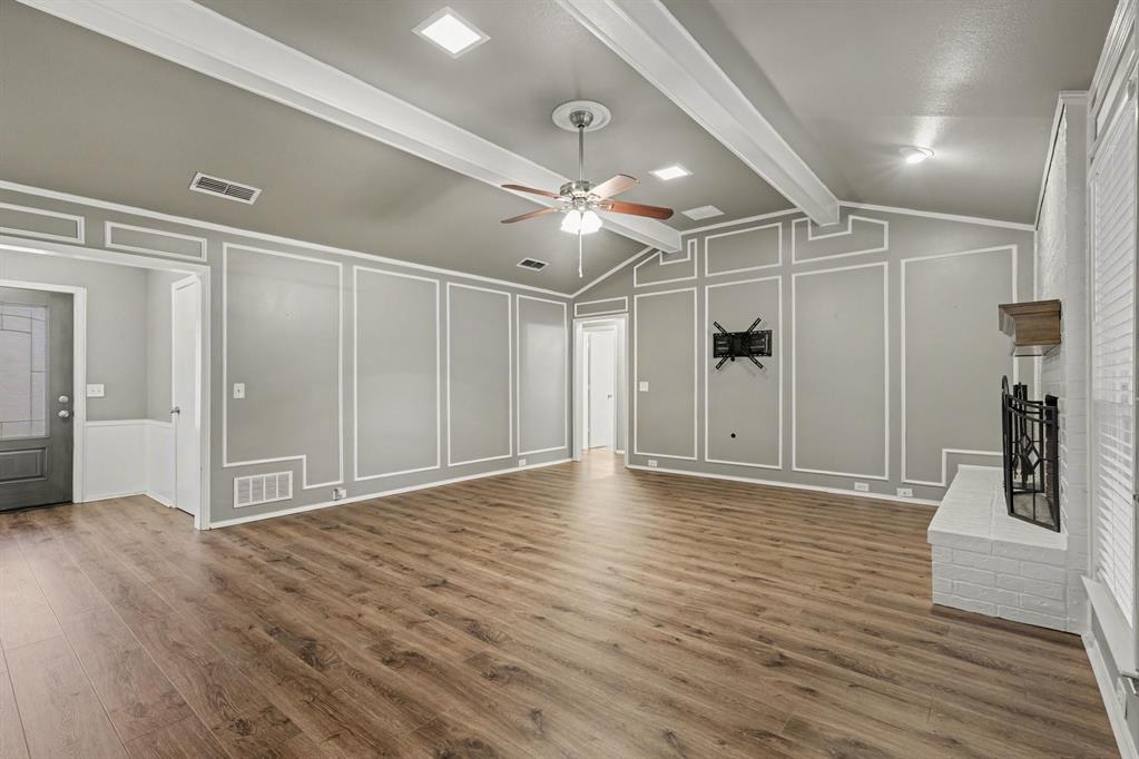 908 Thoreau Lane Allen, TX 75002 - Photo 10 of 31 a view of an empty room with wooden floor