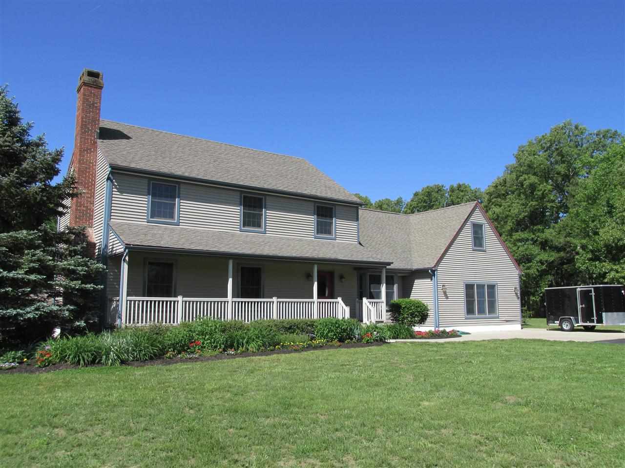562 Mill Road Woodbine, NJ 08270 - Photo 1 of 1 a front view of a house with a garden and porch