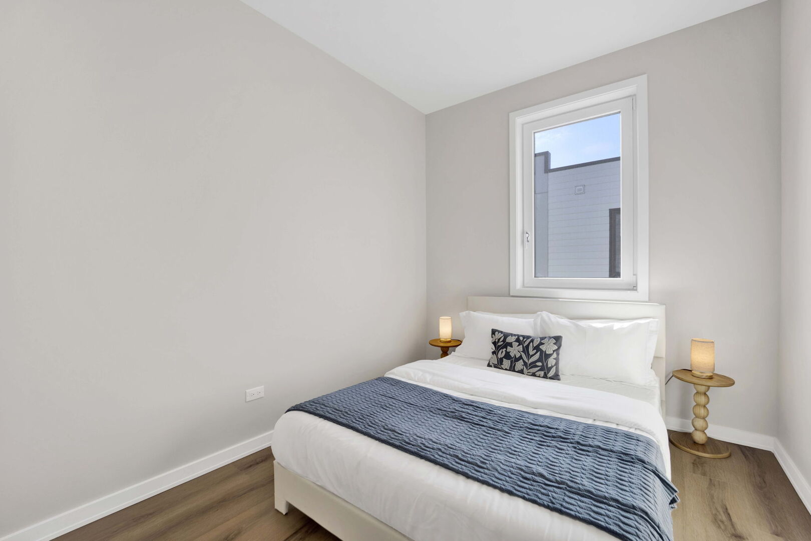 944 Beloit Avenue, Unit 2 Forest Park, IL 60130 - Photo 25 of 32 a bedroom with a bed and wooden floor
