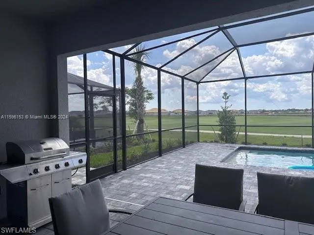 a bed sitting in a bedroom next to a large window