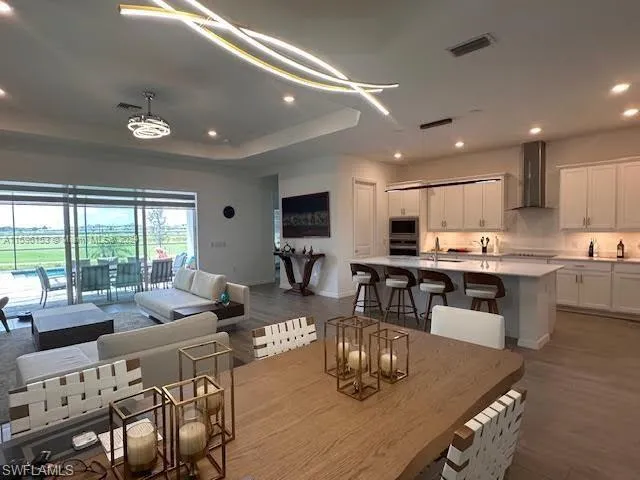a large kitchen with a table and chairs