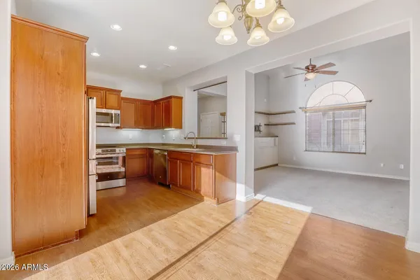 an empty room with a window and closet
