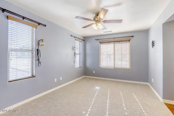 a view of a hallway with wooden floor and entryway
