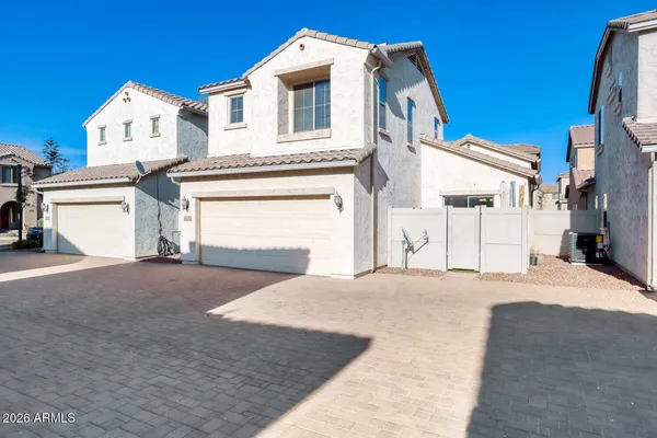 a view of backyard with deck and garden
