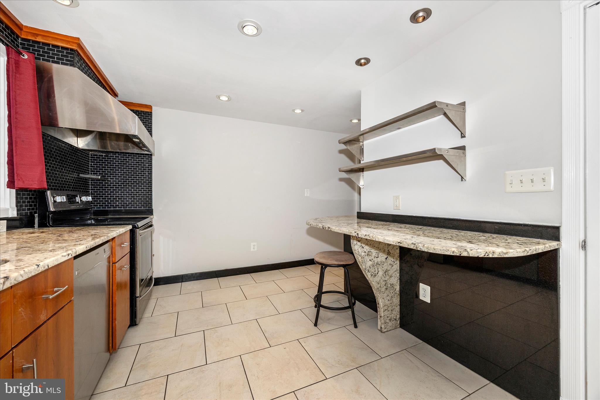 17 East 13th Street Frederick, MD 21701 - Photo 12 of 53 a kitchen with stainless steel appliances granite countertop a sink and cabinets