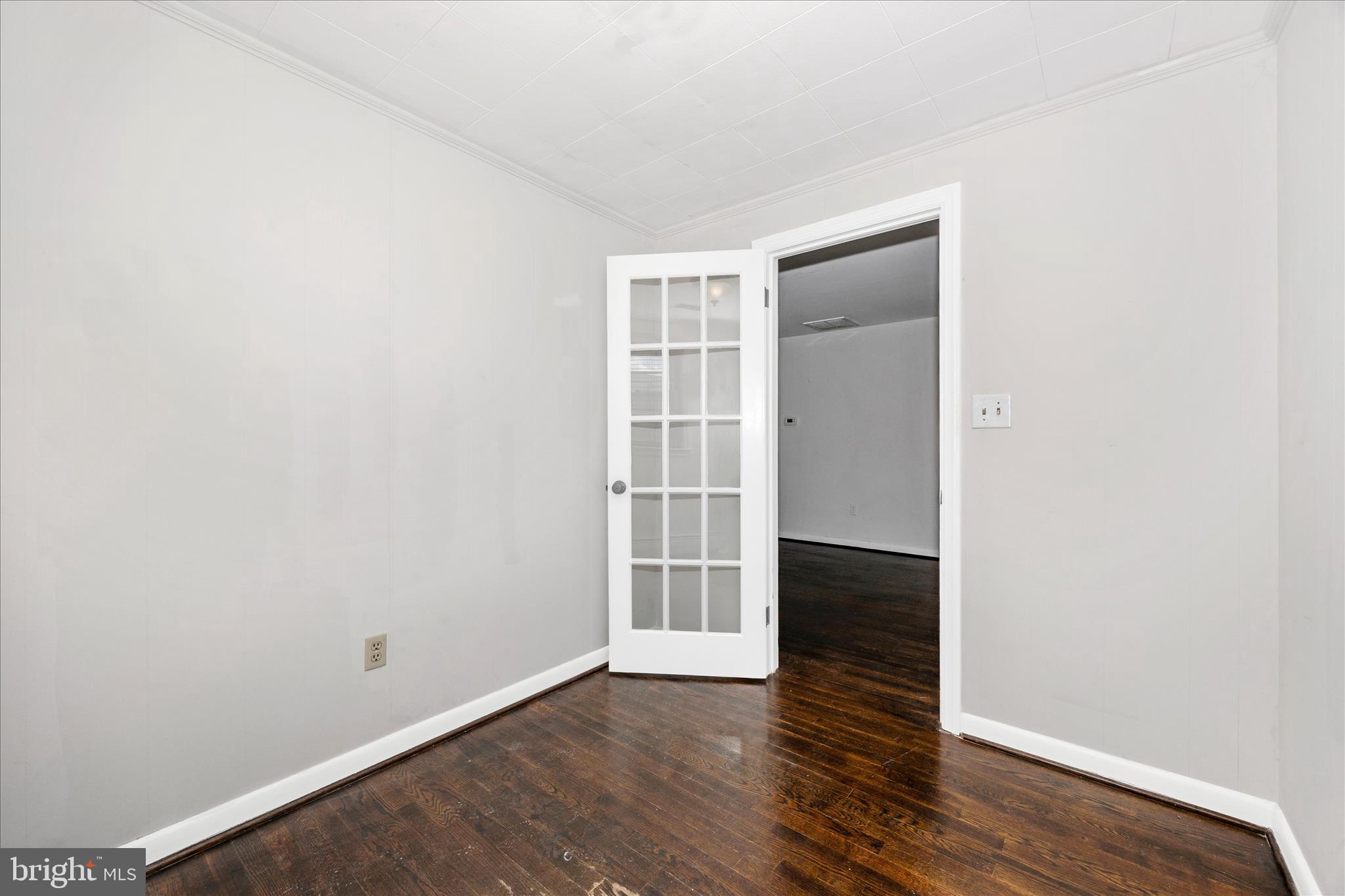 17 East 13th Street Frederick, MD 21701 - Photo 17 of 53 an empty room with wooden floor and windows
