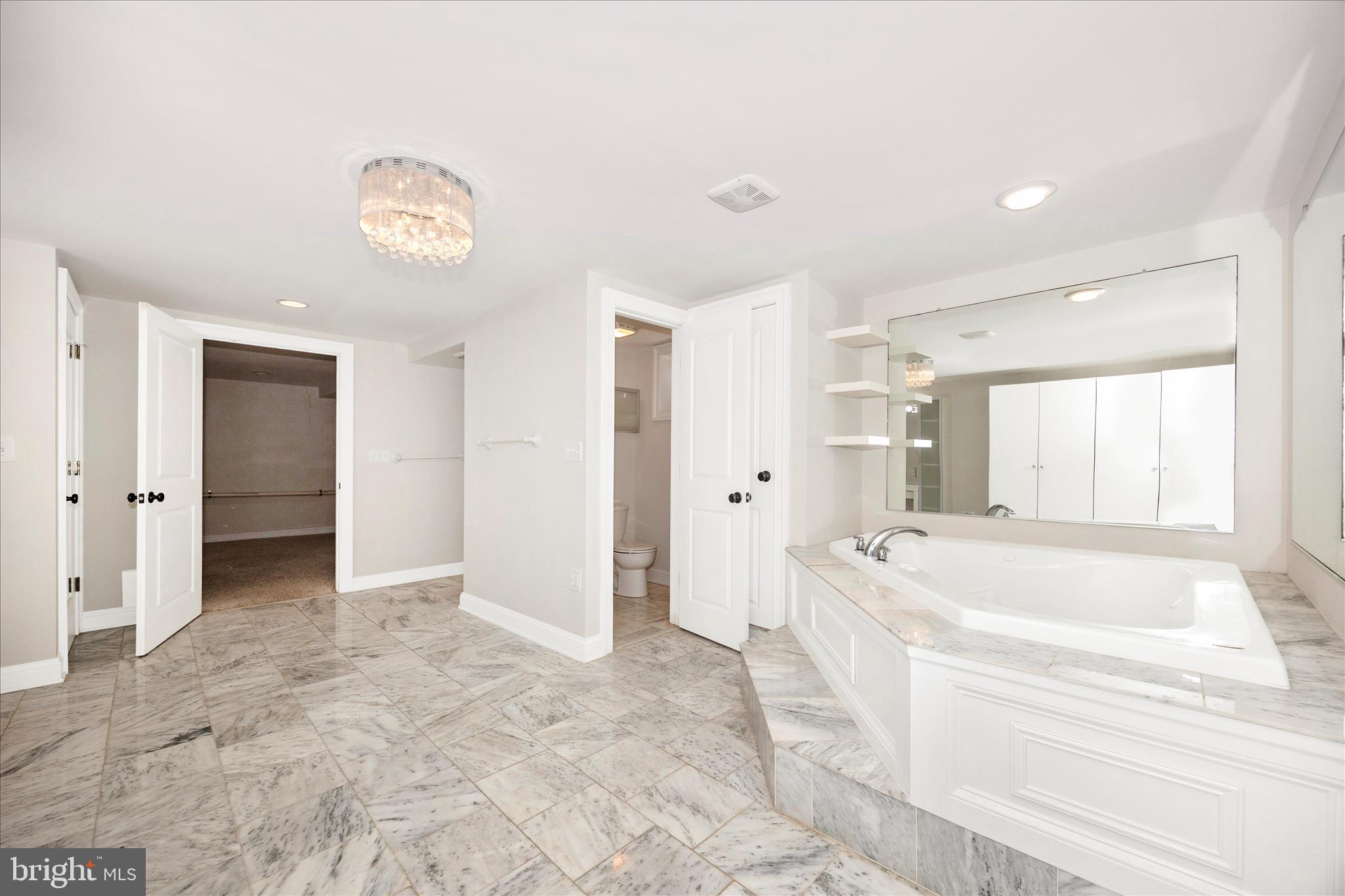 17 East 13th Street Frederick, MD 21701 - Photo 35 of 53 a spacious bathroom with a granite countertop tub shower and sink