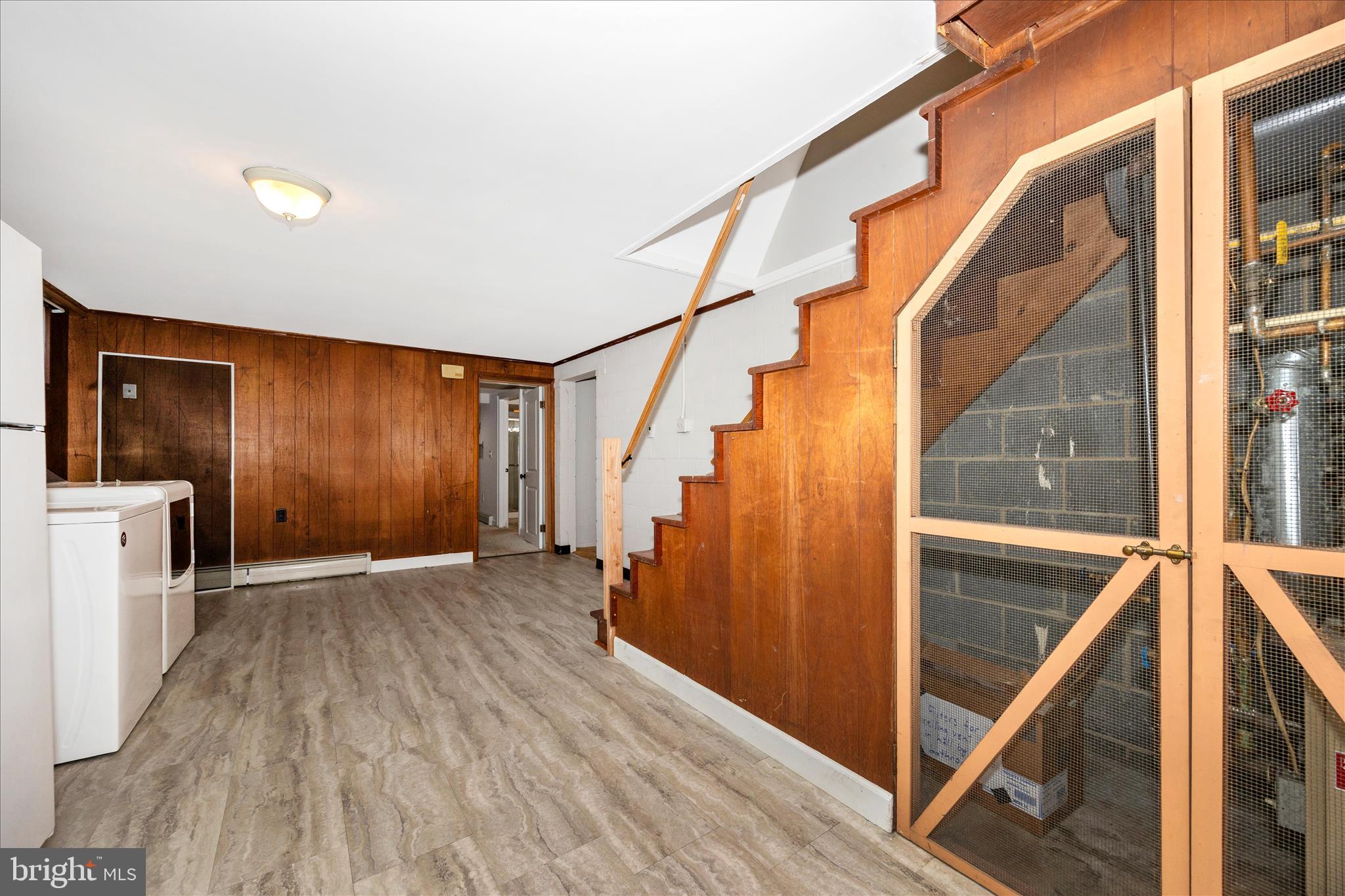 17 East 13th Street Frederick, MD 21701 - Photo 39 of 53 a view of hallway with stairs and wooden floor