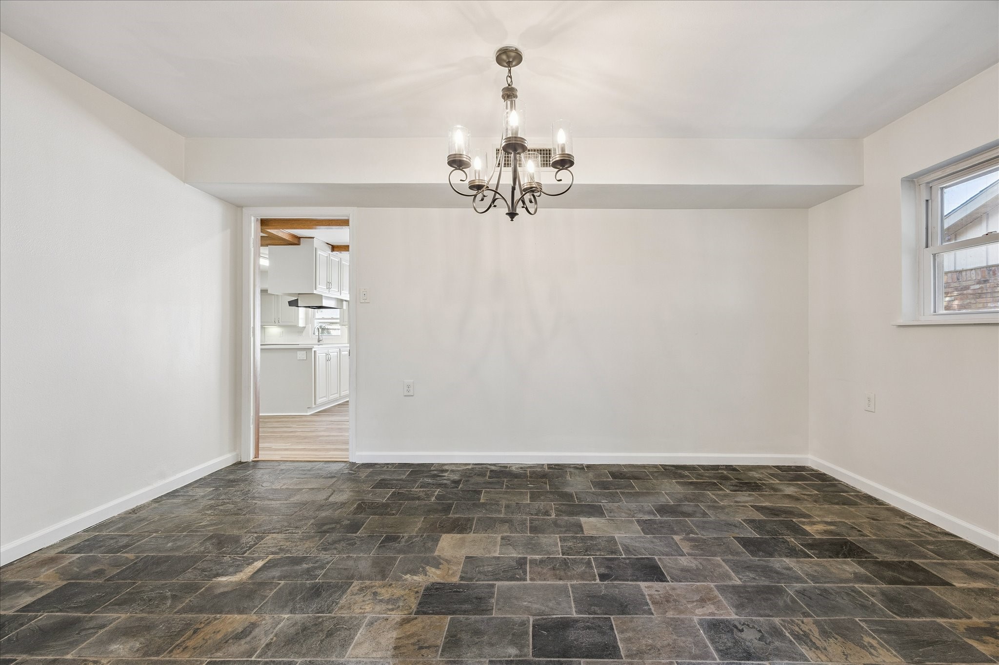 9014 Dunlap Street Houston, TX 77074 - Photo 11 of 23 a view of a chandelier in an empty room