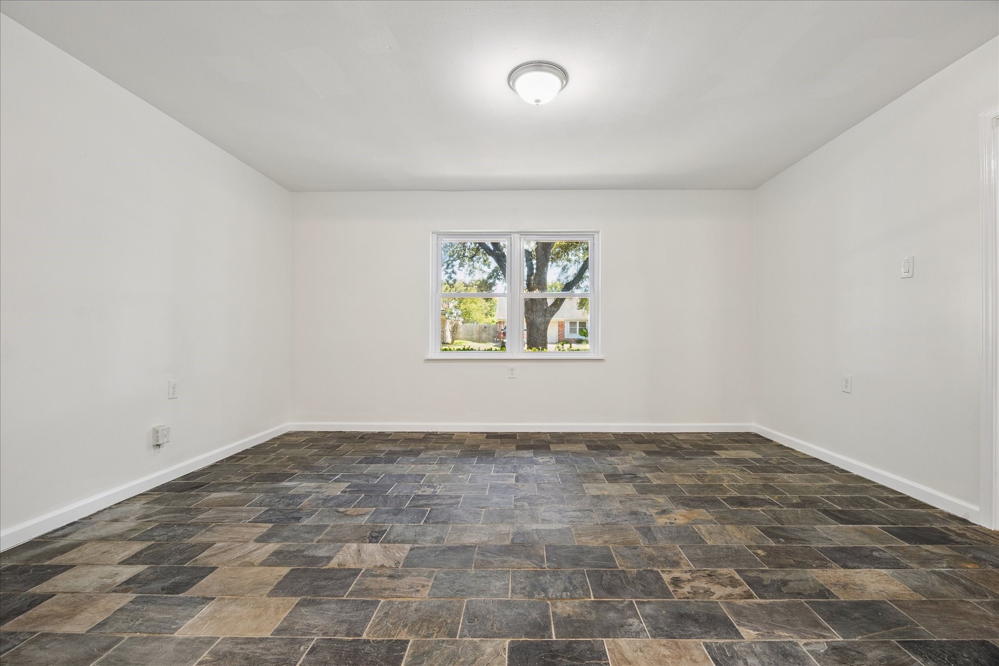 9014 Dunlap Street Houston, TX 77074 - Photo 14 of 23 an empty room with windows