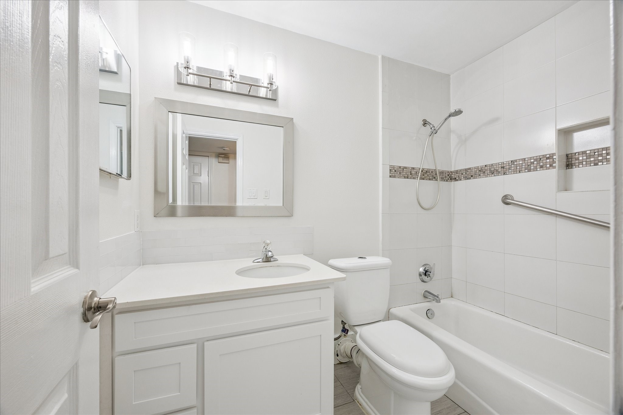 9014 Dunlap Street Houston, TX 77074 - Photo 19 of 23 a bathroom with a sink a toilet and a bathtub