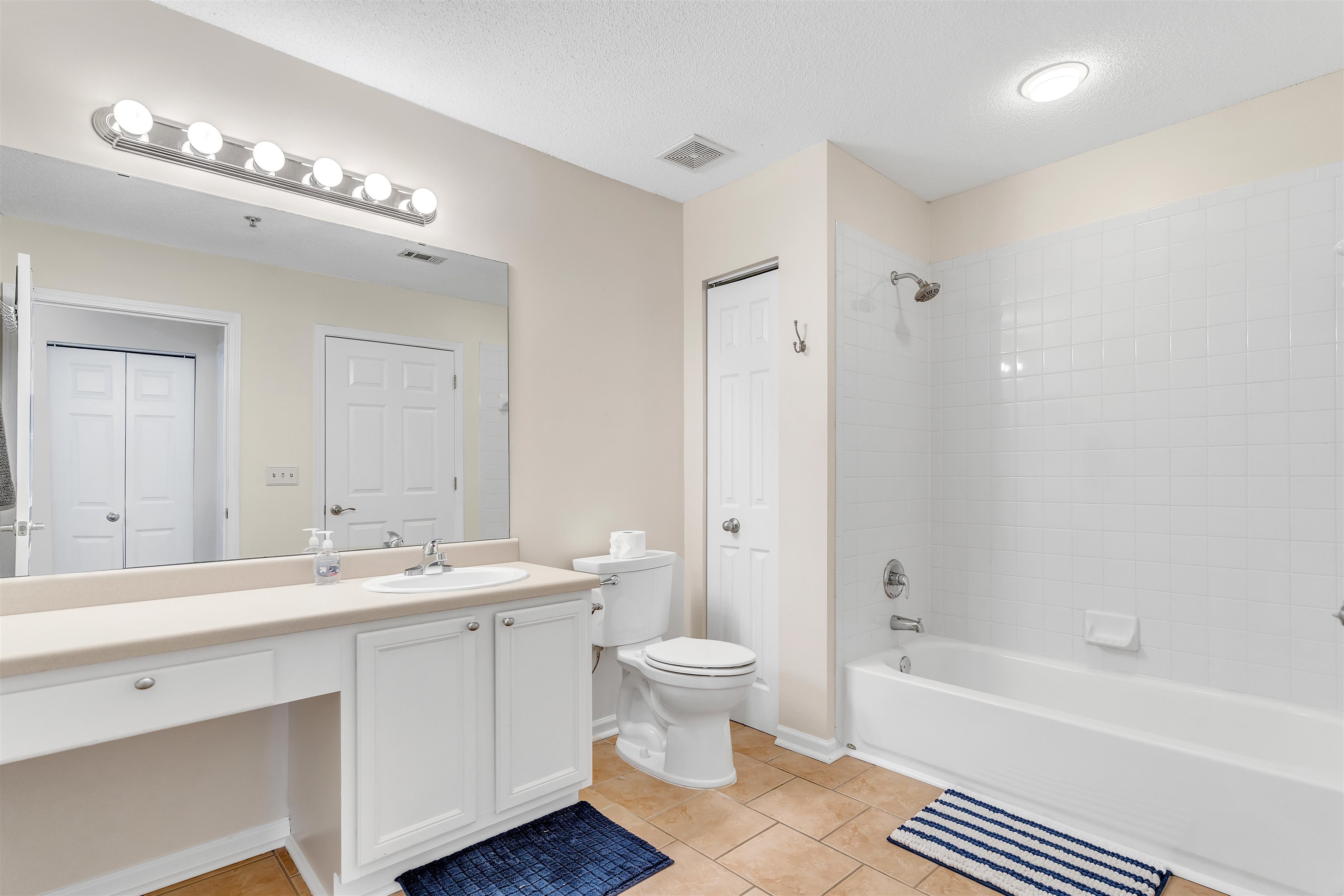 1213 Oak Timber Circle, Unit 25 Collierville, TN 38017 - Photo 14 of 25 Full bathroom featuring a closet, vanity, and visible vents
