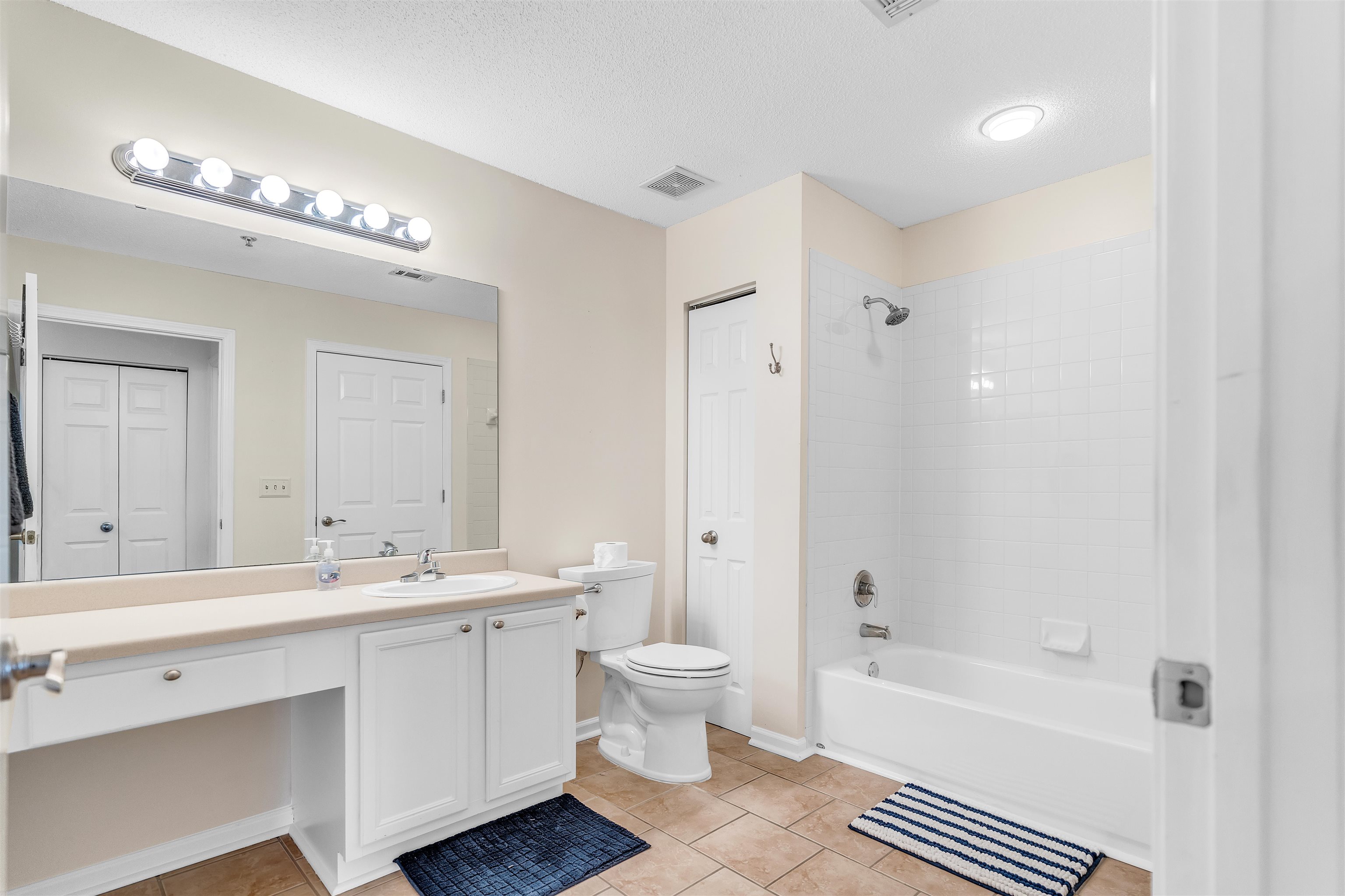 1213 Oak Timber Circle, Unit 25 Collierville, TN 38017 - Photo 15 of 25 Full bath with shower / tub combination, vanity, visible vents, a closet, and tile patterned floors