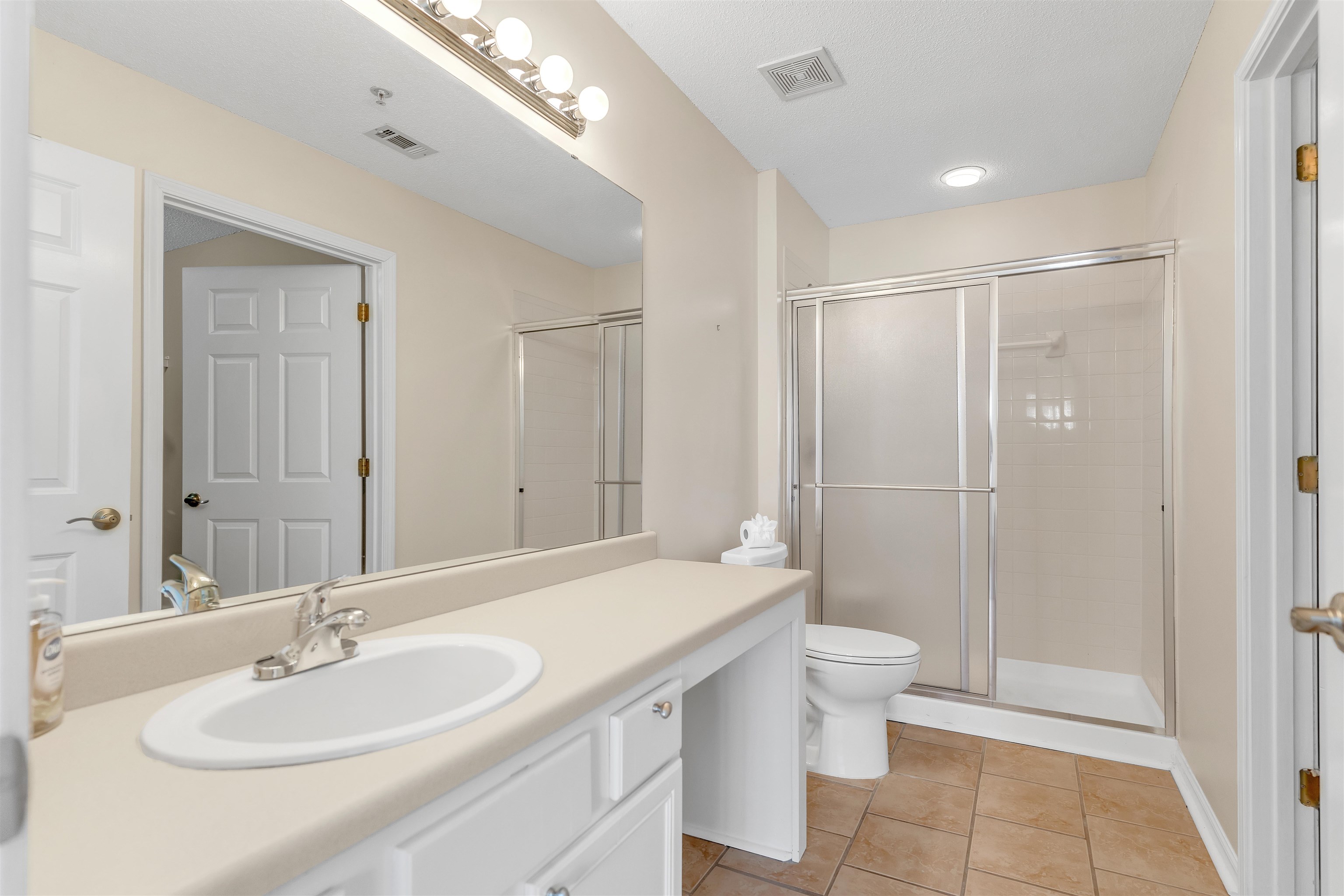 1213 Oak Timber Circle, Unit 25 Collierville, TN 38017 - Photo 20 of 25 Full bathroom featuring vanity, tile patterned flooring, a shower stall, and visible vents