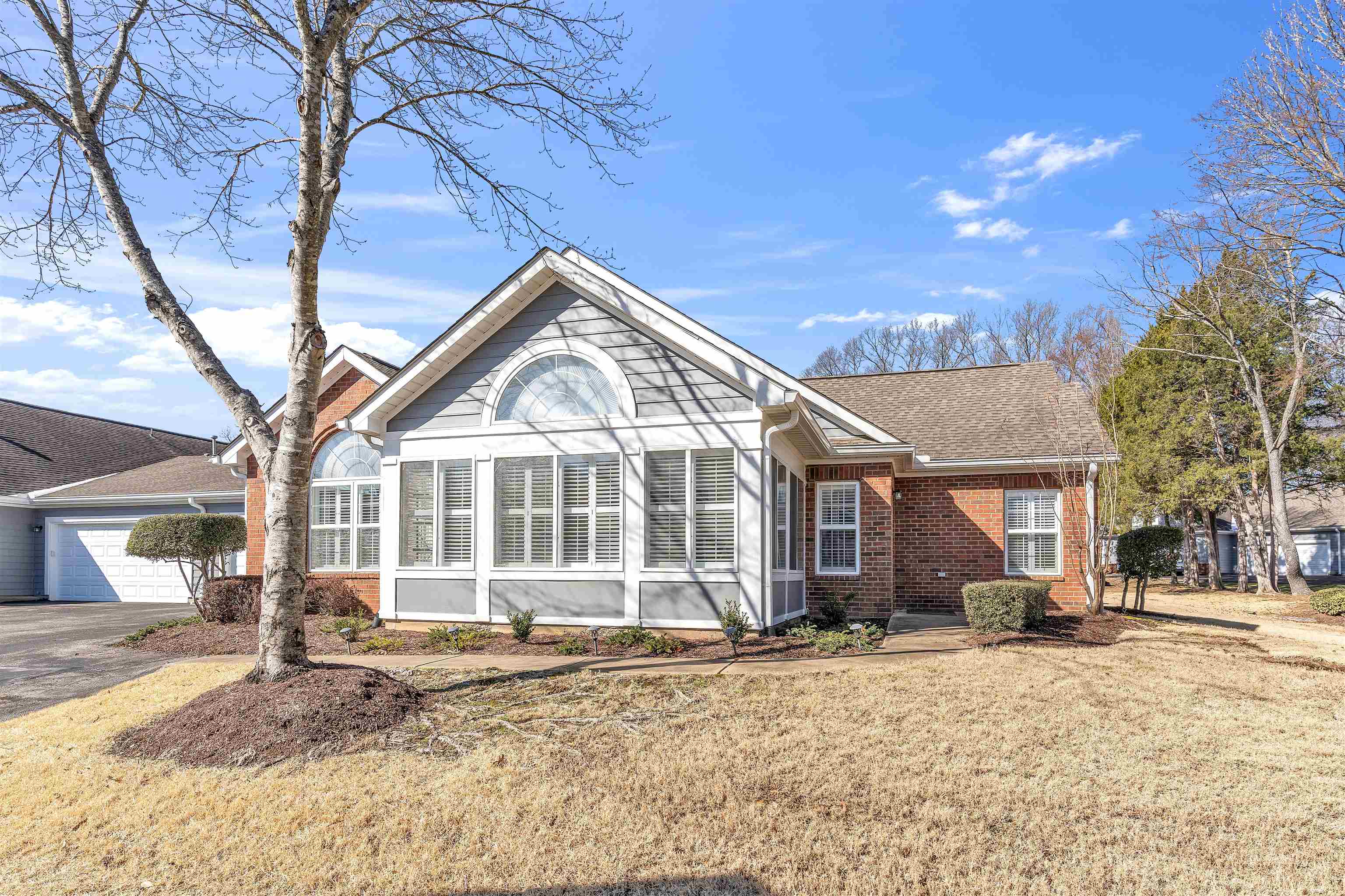 1213 Oak Timber Circle, Unit 25 Collierville, TN 38017 - Photo 2 of 25 Front view of Condo, tons of windows with natural light! 2 car garage and views of nature!