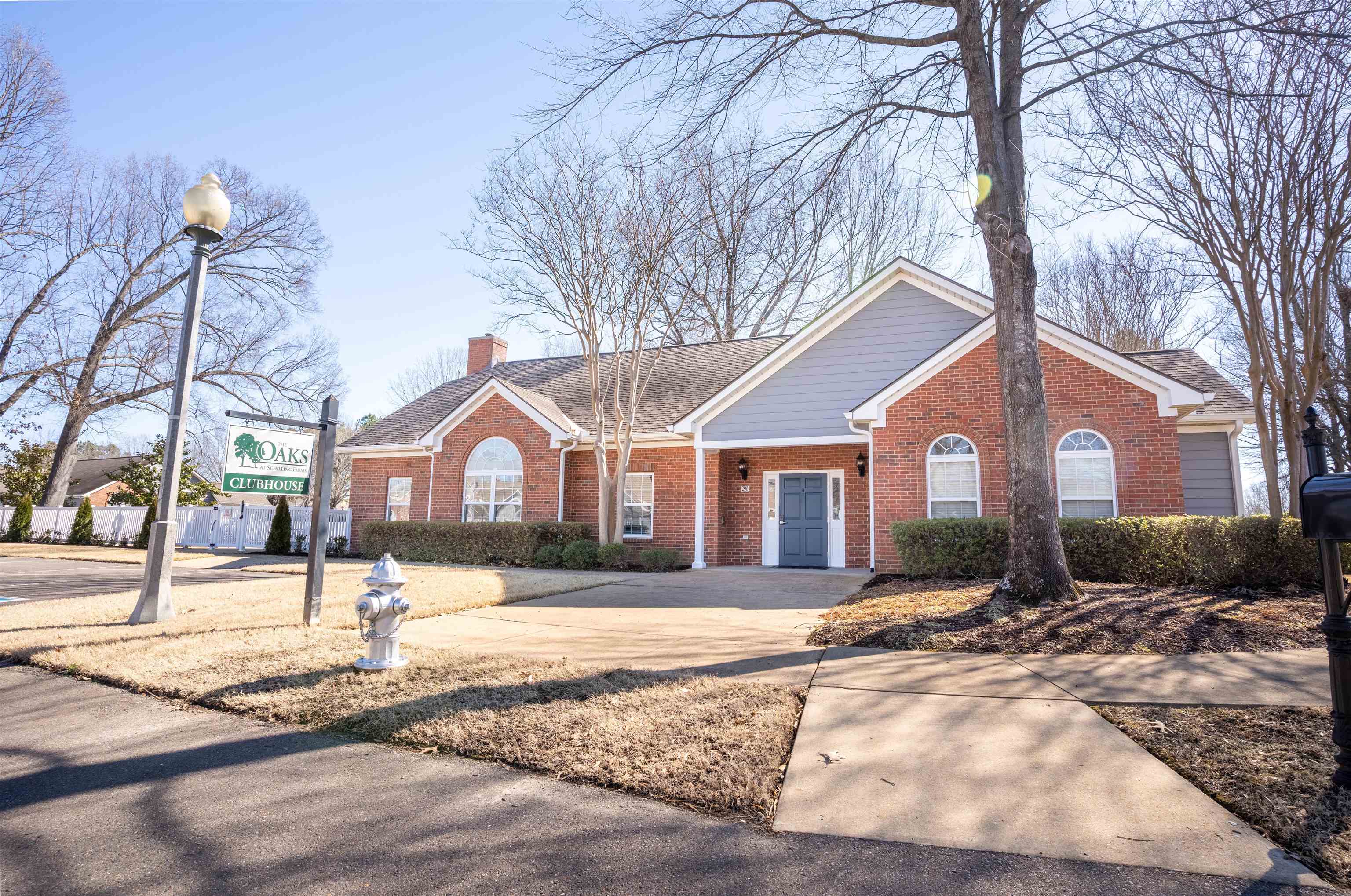 1213 Oak Timber Circle, Unit 25 Collierville, TN 38017 - Photo 24 of 25 Ranch-style home with brick siding, a chimney, and a shingled roof