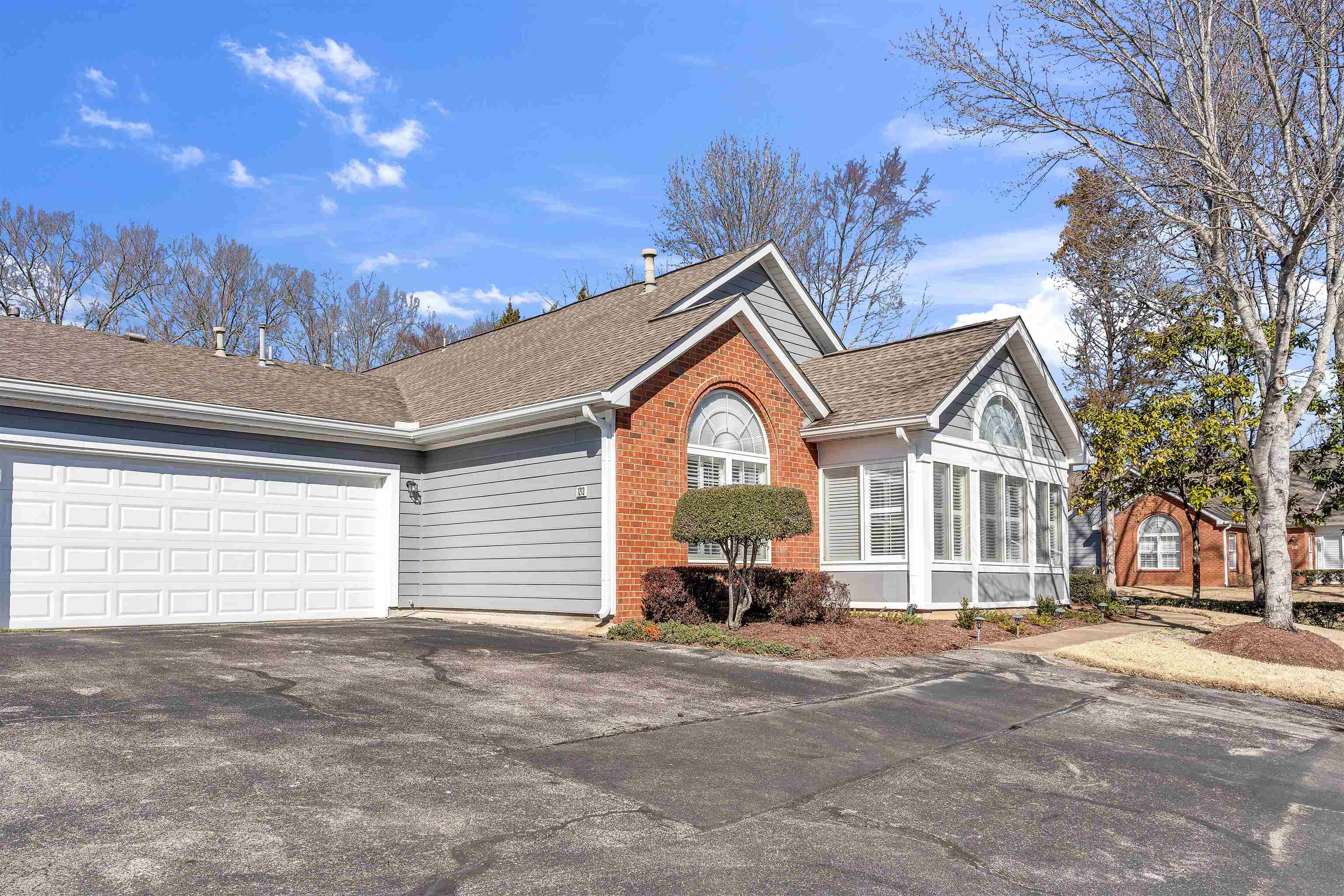 1213 Oak Timber Circle, Unit 25 Collierville, TN 38017 - Photo 3 of 25 Single story home with driveway, roof with shingles, a garage, and brick siding