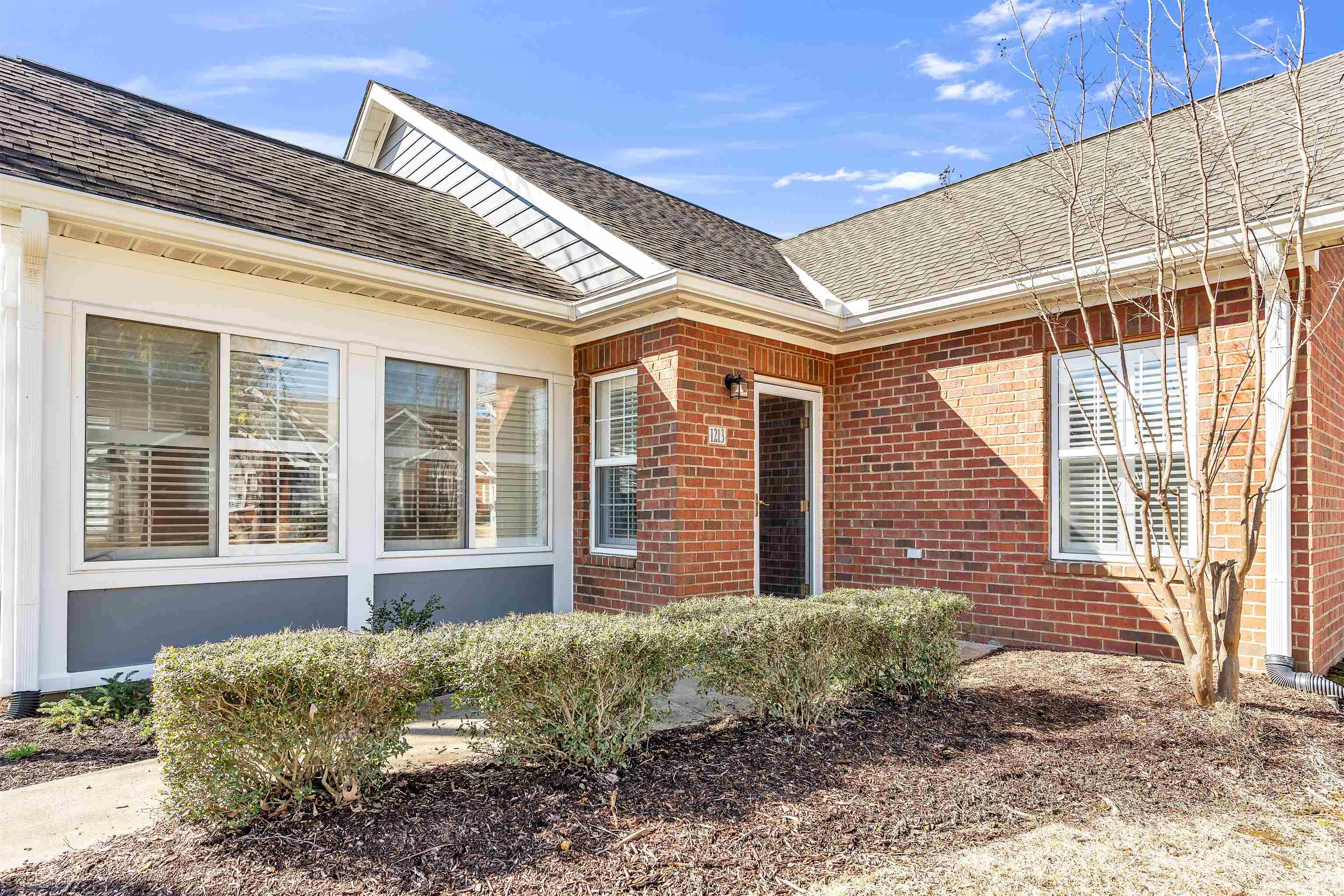 1213 Oak Timber Circle, Unit 25 Collierville, TN 38017 - Photo 5 of 25 Doorway to property with brick siding and roof with shingles
