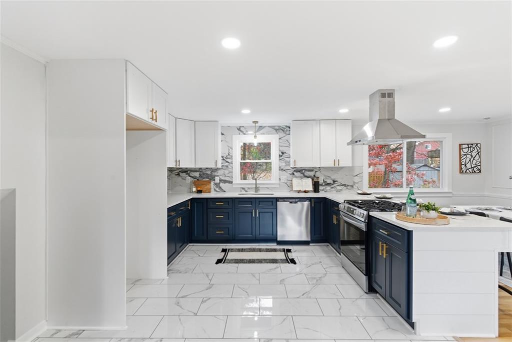 125 South Jamestown Road Coraopolis, PA 15108 - Photo 11 of 44 a kitchen with stainless steel appliances granite countertop a stove sink and cabinets