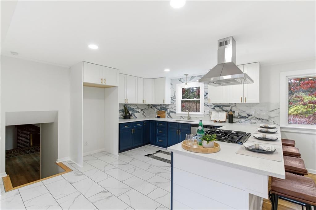 125 South Jamestown Road Coraopolis, PA 15108 - Photo 13 of 44 a kitchen with a refrigerator a stove a sink dishwasher with a dining table and chairs