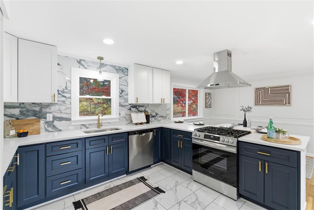 125 South Jamestown Road Coraopolis, PA 15108 - Photo 14 of 44 a kitchen with stainless steel appliances a sink stove and cabinets