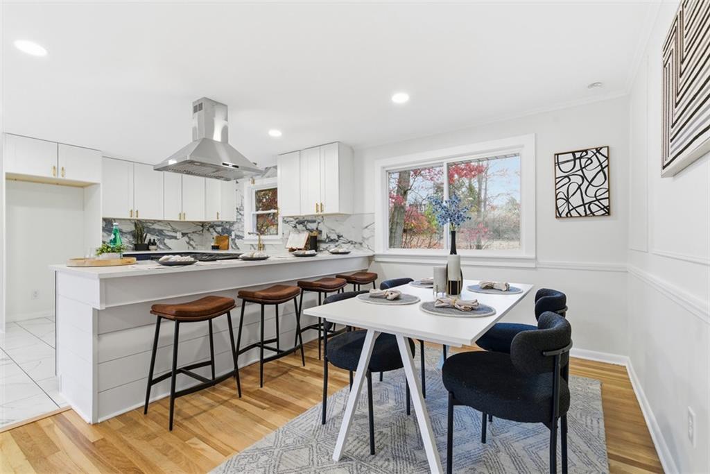 125 South Jamestown Road Coraopolis, PA 15108 - Photo 16 of 44 a kitchen with stainless steel appliances kitchen island granite countertop a dining table chairs and a refrigerator