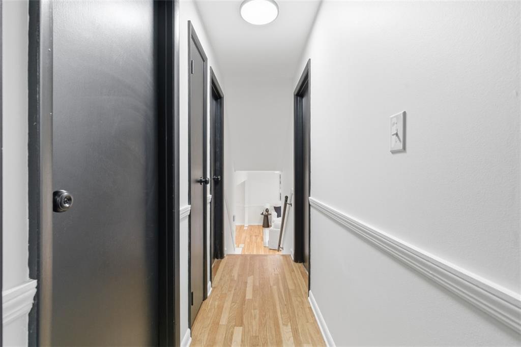 125 South Jamestown Road Coraopolis, PA 15108 - Photo 18 of 44 a view of a hallway with wooden floor and a bathroom