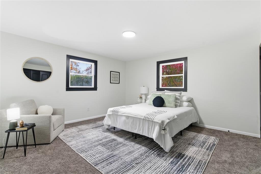 125 South Jamestown Road Coraopolis, PA 15108 - Photo 20 of 44 a bedroom with a large bed and a chandelier