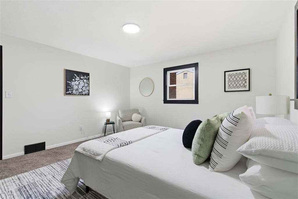 125 South Jamestown Road Coraopolis, PA 15108 - Photo 21 of 44 a bedroom with a bed and a couch