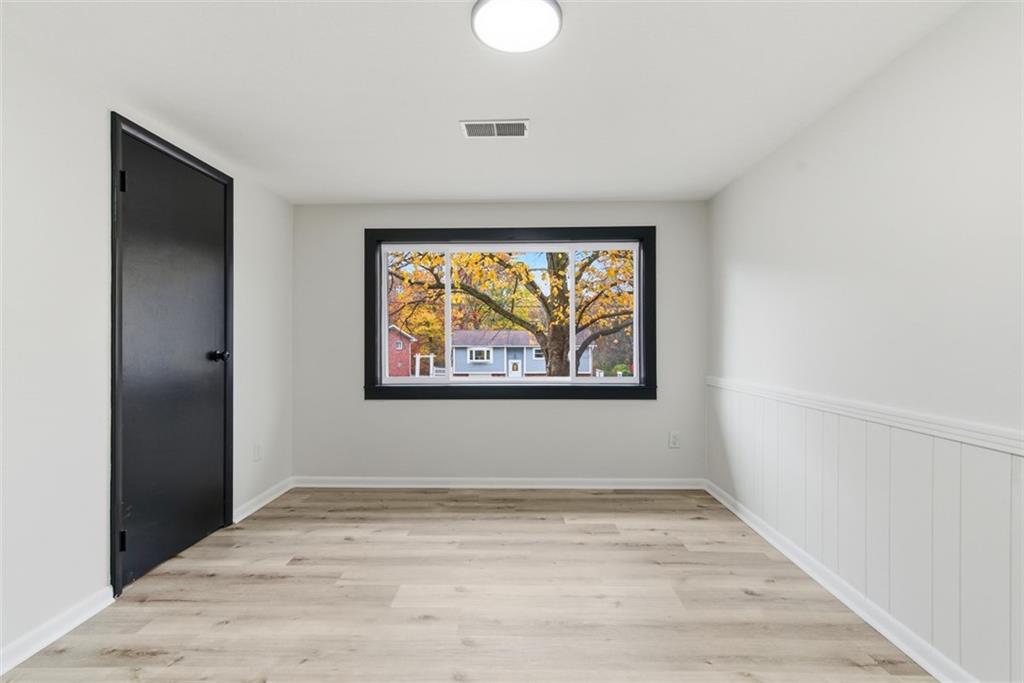 125 South Jamestown Road Coraopolis, PA 15108 - Photo 32 of 44 a view of an empty room with wooden floor and a window