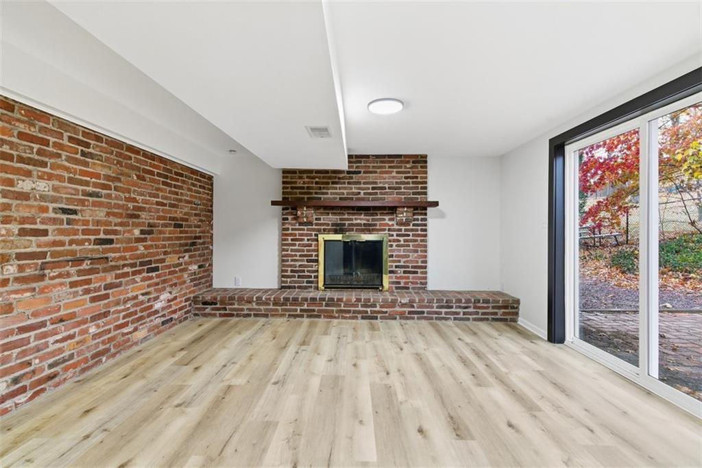 125 South Jamestown Road Coraopolis, PA 15108 - Photo 34 of 44 a view of an empty room with wooden floor fireplace and a window