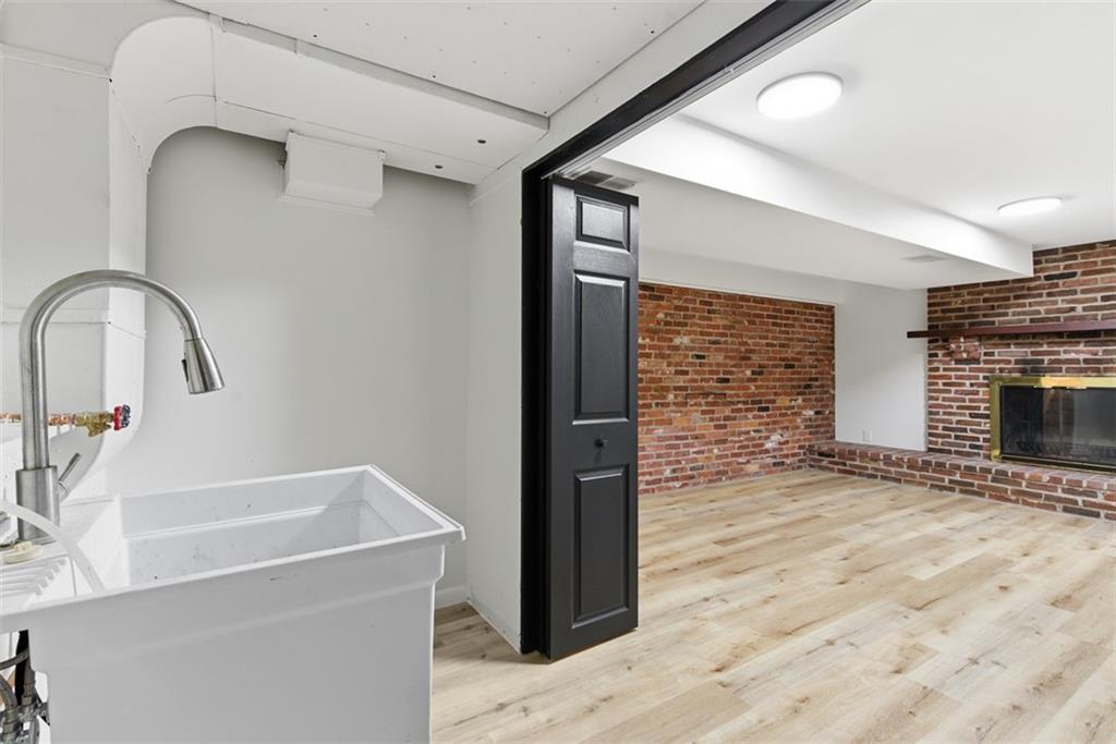 125 South Jamestown Road Coraopolis, PA 15108 - Photo 38 of 44 a view of a kitchen cabinets a sink and a fireplace