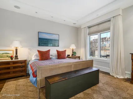 a bedroom with bed and window