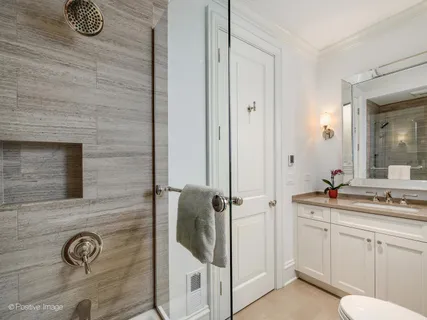 a bathroom with a sink and mirror