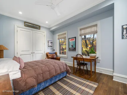 a bedroom with a bed and a table