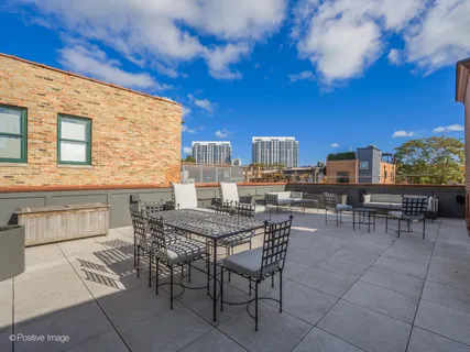 a view of a dinning tables and chairs in the terrace