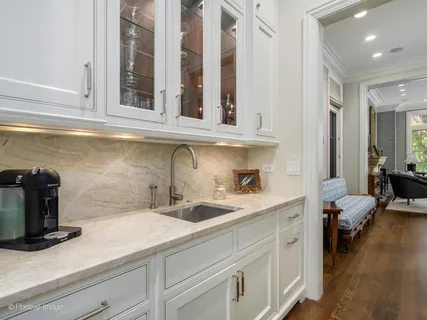a kitchen with a sink and cabinets