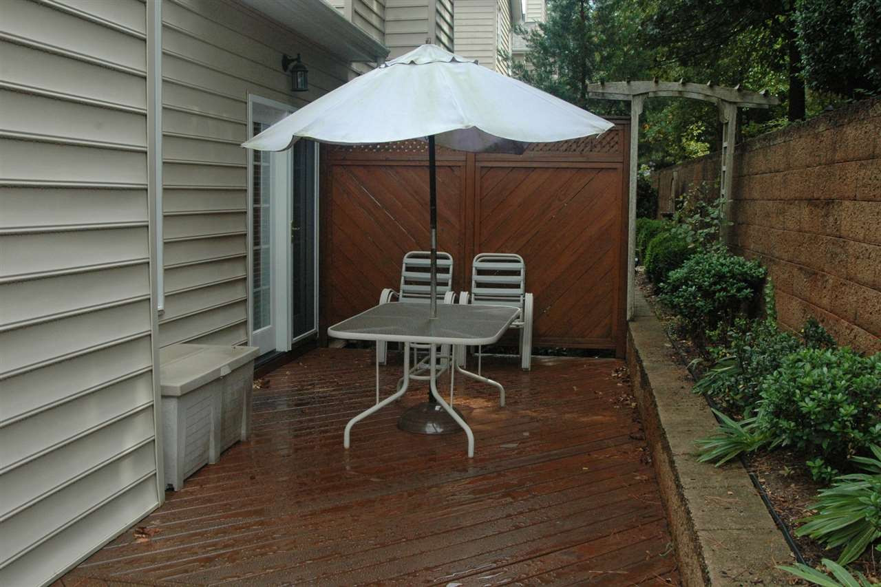 7316 Fontana Ridge Lane Raleigh, NC 27613 - Photo 6 of 20 Seller optioned to have the deck extended the length of the home. Also added outside access from the first floor owners suite Patio/Deck