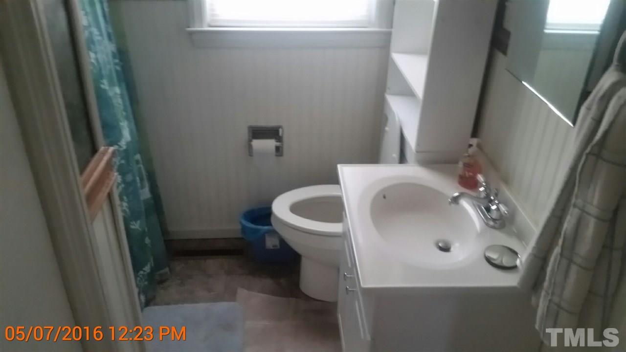 911 Frank Street Roxboro, NC 27573 - Photo 5 of 7 a bathroom with a sink and a toilet