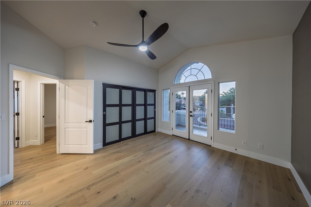 8800 Lusso Las Vegas, NV 89134 - Photo 65 of 85 Unfurnished bedroom featuring vaulted ceiling, light wood-type flooring, a ceiling fan, and access to outside
