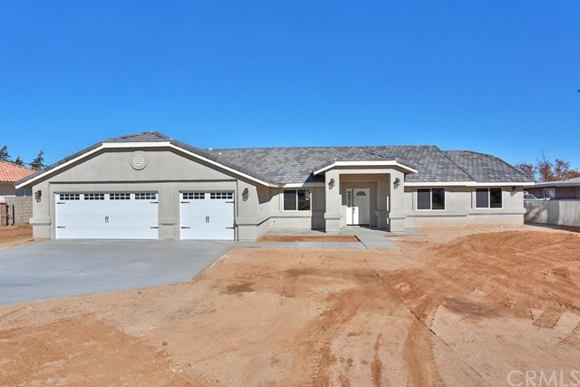 22227 Skyline Drive Apple Valley, CA 92308 - Photo 1 of 34 a front view of a house with a yard