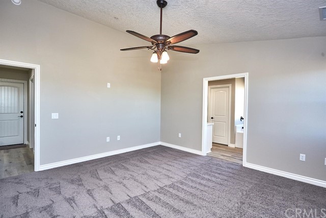 22227 Skyline Drive Apple Valley, CA 92308 - Photo 18 of 34 a view of a chandelier fan and entryway