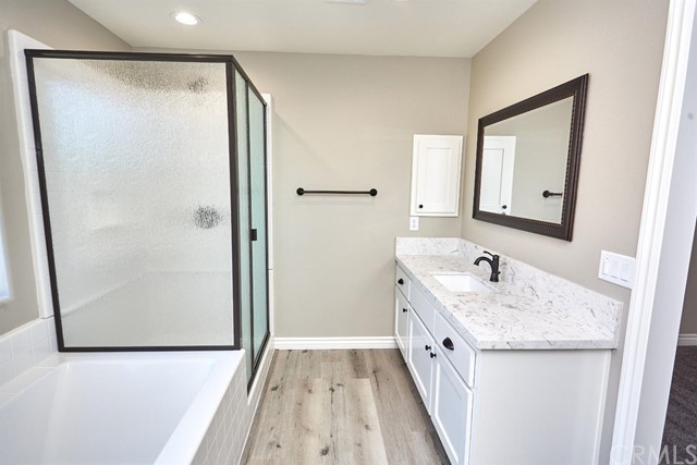 22227 Skyline Drive Apple Valley, CA 92308 - Photo 28 of 34 a bathroom with a double vanity sink and mirror