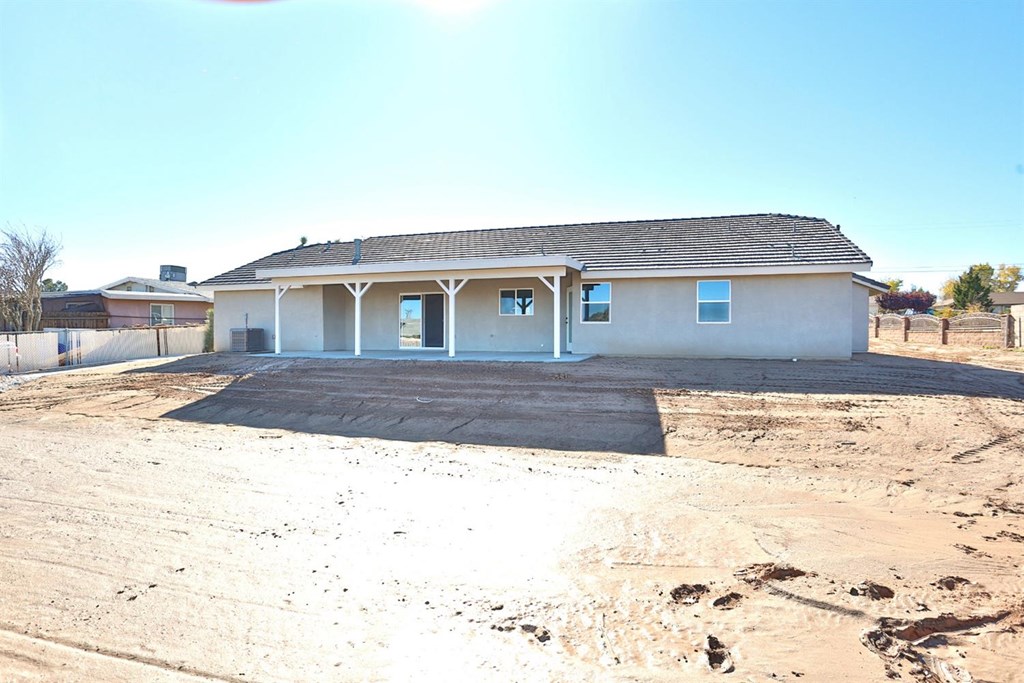 22227 Skyline Drive Apple Valley, CA 92308 - Photo 34 of 34 a front view of a house with a yard