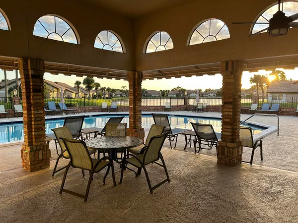 a view of a chairs and table in the patio