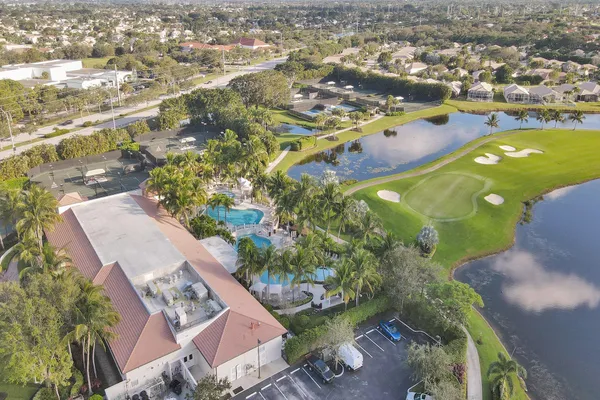 an aerial view of a houses with a yard