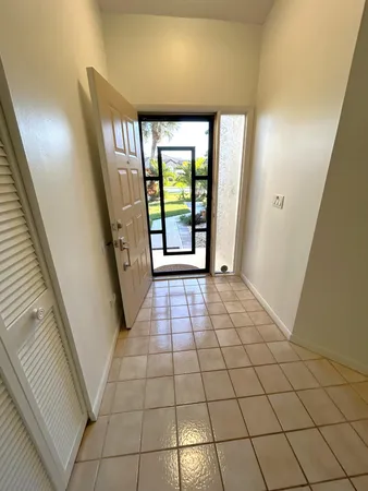 a view of entryway with stairs and a window