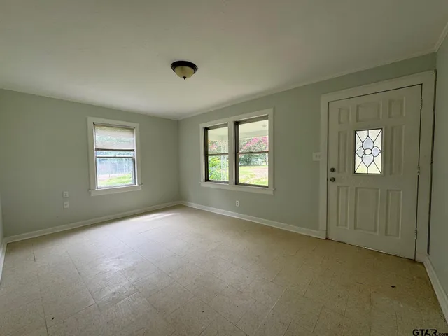 an empty room with windows