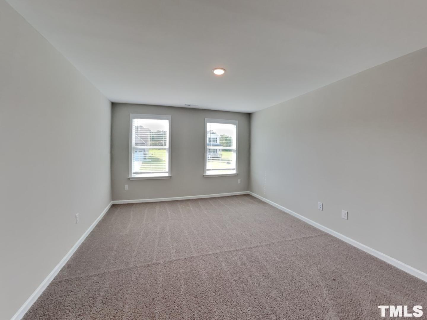 106 Two Daughters Streme Smithfield, NC 27577 - Photo 13 of 16 a view of an empty room with a window