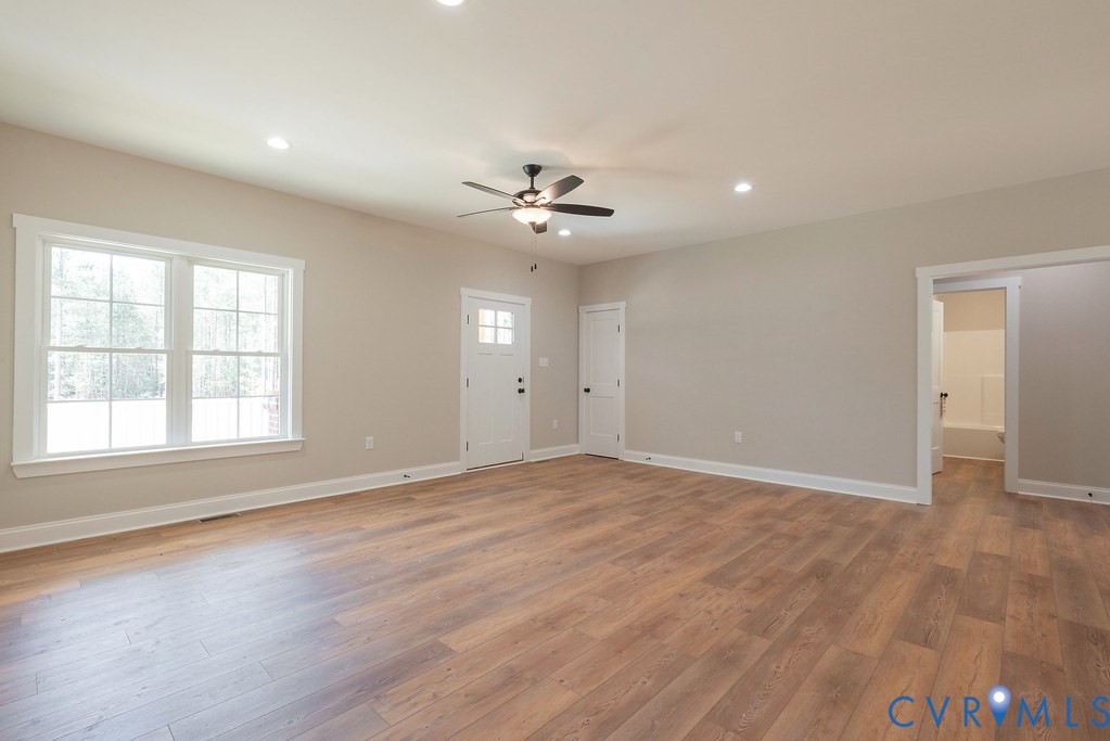 5200 Three Chopt Road Louisa, VA 23093 - Photo 13 of 47 wooden floor in an empty room with a window